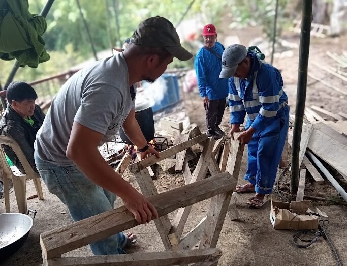Bayanihan tradition wood construction in Philippine village community project