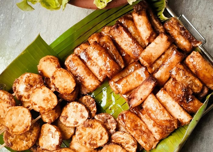 Turon and kamote cue skewers served on a banana leaf, popular vegan Filipino street food snacks